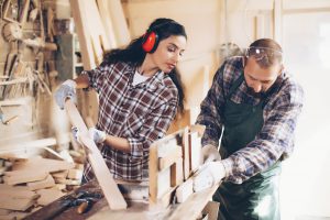 Two working carpenters portrait . Concept for small or family business